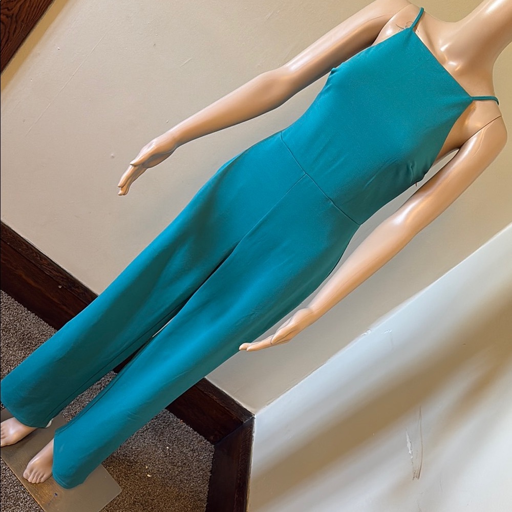Sleek Blue Sleeveless Jumpsuit with High Neckline